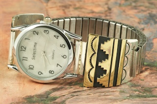 Beautiful Sterling Silver Watch Tips with Gold fill contemporary pueblo design. Mens quartz watch with expandable band. Created by Navajo Artist Tommy Singer. Signed.